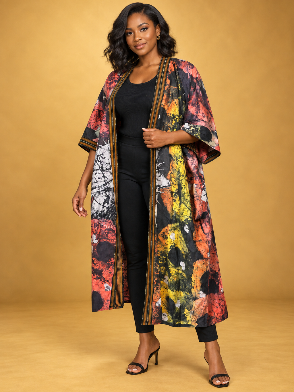 Sunset Batik Long Kimono in orange, black and white African batik print by ILÉ AYỌ̀KÁ.