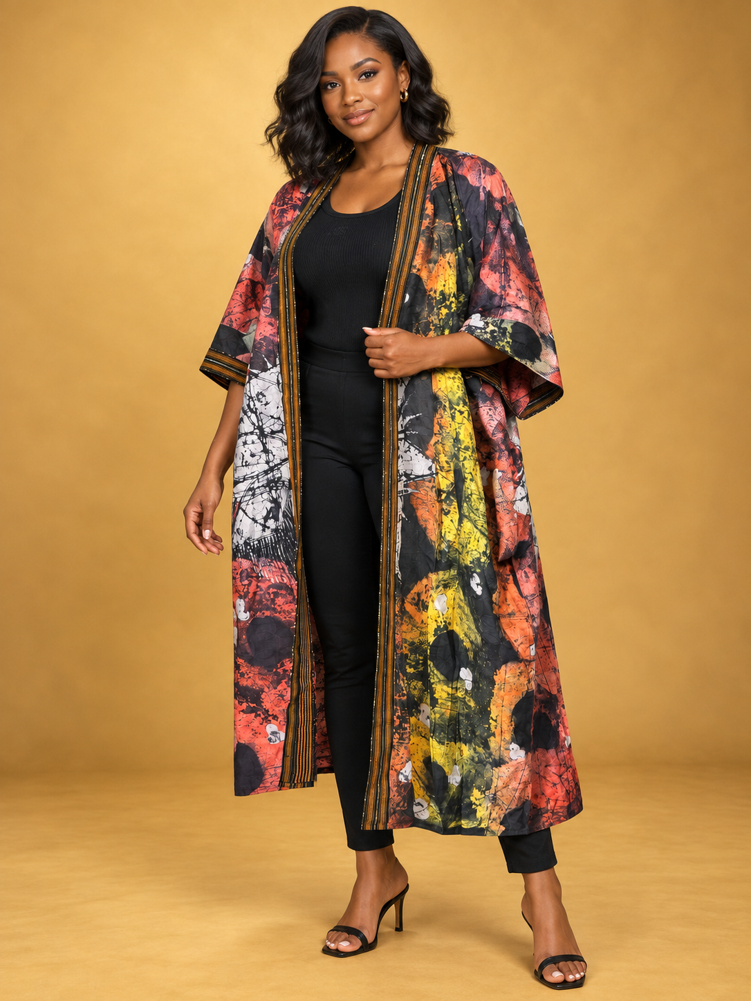 Sunset Batik Long Kimono in orange, black and white African batik print by ILÉ AYỌ̀KÁ.