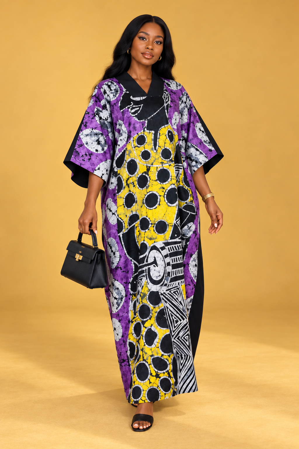 Model wearing a purple, yellow, black and white batik maxi bubu dress by ILÉ AYỌ̀KÁ.