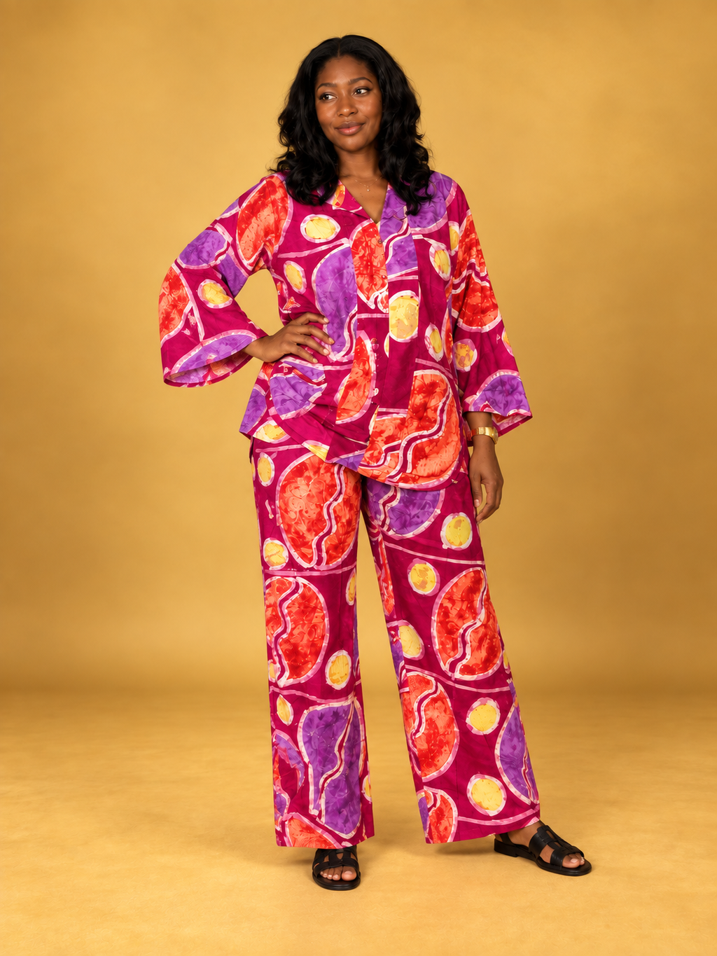 Ajoke 2 Piece Set in vibrant magenta, purple, orange and yellow batik print by ILÉ AYỌ̀KÁ.
